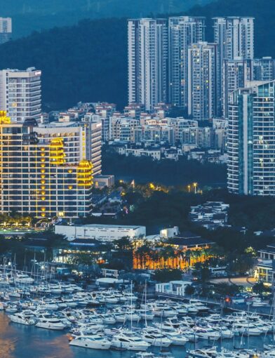 Haikou city with high modern buildings on Nandu River bank